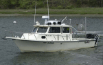 Thumbnail image of figure 6 and link to larger figure. Photograph of the boat used to collect samples and photography in the study area.