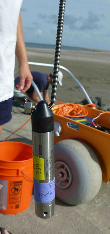 Photograph of an Onset Hobo U20 pressure logger and threaded stainless-steel rod.