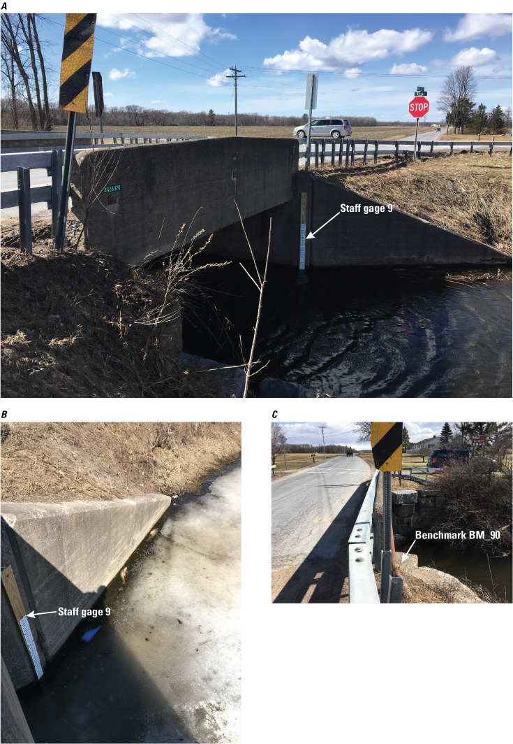 The staff gage is in the water, attached to the bridge wing wall. The benchmark is
               on the same side of the bridge, but is on the opposite side of the stream, on top
               of the wingwall near a red pipe.
