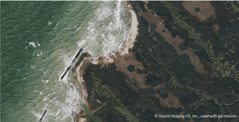 Figure 17. Aerial image shows wave overtopping at the breakwaters during storm surge
                        with wave height greater than 0.9 meter.