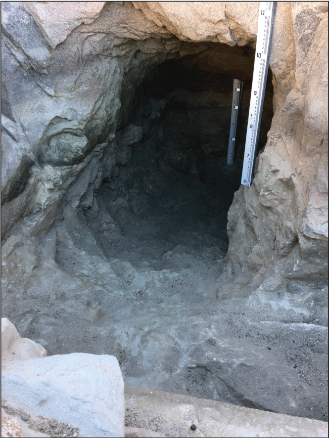 2.4. Inside a cave-like tank with two vertical stage height rods.