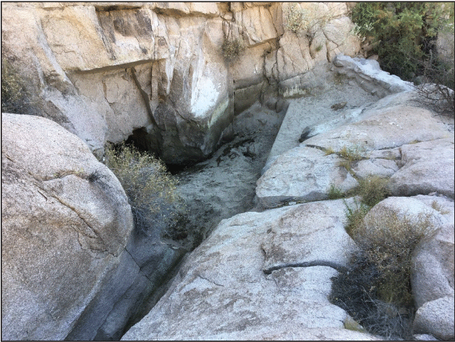 2.5. A rocky catchment channel with a constructed wall.