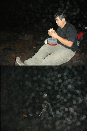 Top: seated man eating over a plastic food container. Bottom: man moves tripod, obscured
                     by droplets on camera lens.