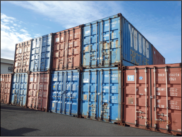 6. Shipping containers side by side and stacked two containers high in the staging
area.