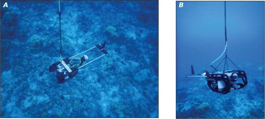 Alttext 5: The drop-camera system is a large camera suspended in the water by a wire.