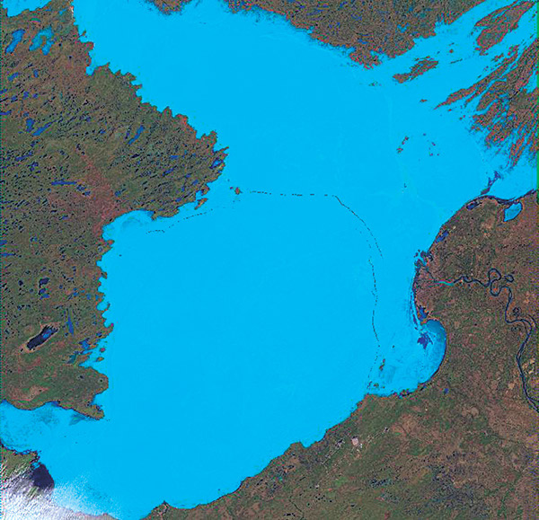 Figure 5-3a.–Three Landsat-7 ETM+ images (bands 3, 4, 5) of the breakup of ice on Great Slave Lake, Northwest Territories, Canada (at about latitude 61.5°N., longitude 14.5°W.) on (A) 4 May 2000, (B) 20 May 2000, and (C) 5 June 2000. Lake ice is shown in light blue, open water in dark blue. Each image covers an area of 185 km by 185 km.