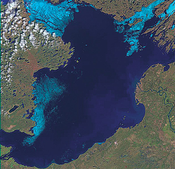 Figure 5-3C.–Three Landsat-7 ETM+ images (bands 3, 4, 5) of the breakup of ice on Great Slave Lake, Northwest Territories, Canada (at about latitude 61.5°N., longitude 14.5°W.) on (C) 5 June 2000. Lake ice is shown in light blue, open water in dark blue. Each image covers an area of 185 km by 185 km.