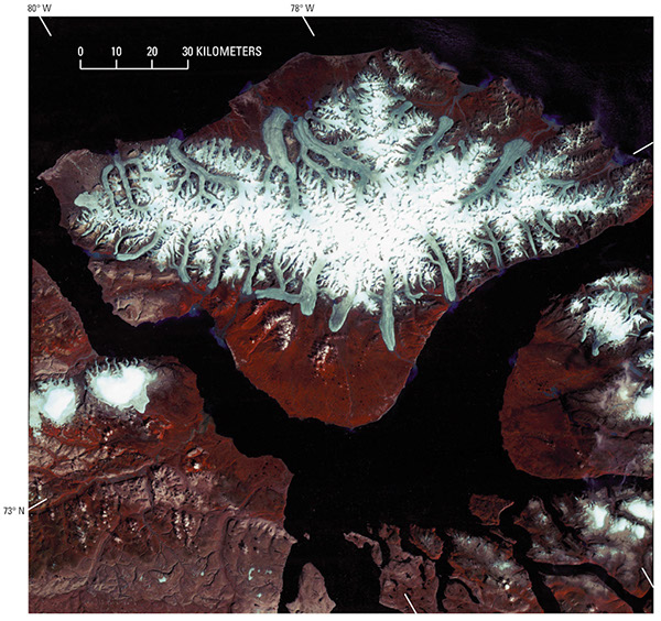 Figure 9.—Outlet glacier. Landsat 2 MSS false-color composite image of outlet glaciers flowing from the ice field on Bylot Island, Nunavut, Canada (for an extended caption, see Chapter J of “Satellite Image Atlas of Glaciers of the World,” its cover page and p. J173, fig. 3).