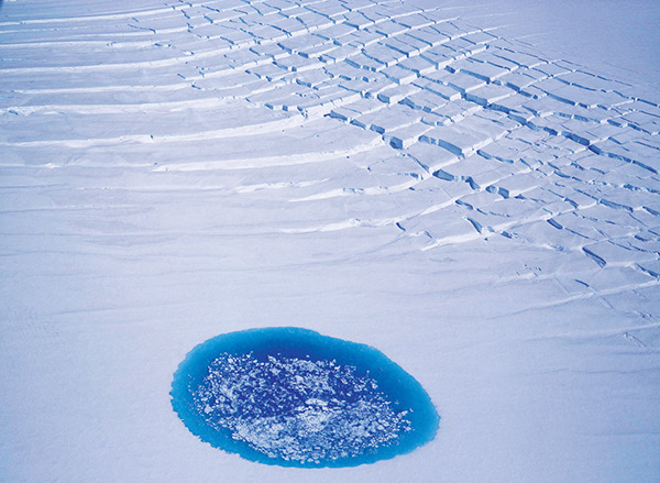 Figure 87.—Oblique aerial photograph of a supraglacial lake taken on 27 July 1995, one year after the surge of Síðujökull, an outlet glacier of the Vatnajökull ice cap, Iceland. Photograph by Oddur Sigurðsson, Icelandic Meteorological Office.