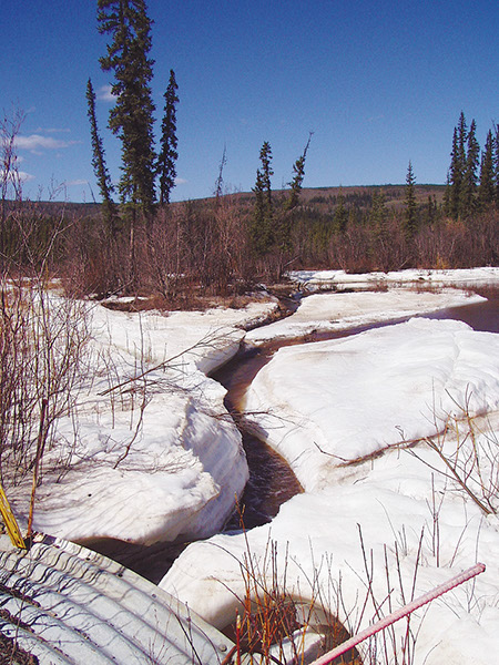 Figure 19A, Aufeis at Big Eldorado Creek where it enters a culvert below Goldstream Road, 6 km north of Fairbanks, Alaska, on 16 May 2006.