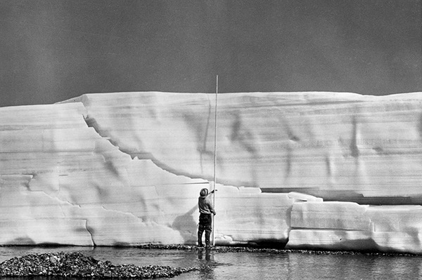 Figure 32.—The face of an icing (5-m high) along Echooka River, northern Alaska, 11 July 1972 (Sloan and others, 1976). 
  