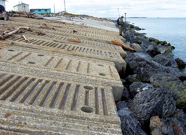 Figure 43.—Attempt to control shoreline erosion using riprap at
Tuktoyaktuk, Northwest Territories, Canada
(photograph by Steve Solomon, Geological Survey of Canada). 
  