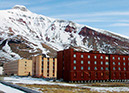 Figure 44.—Pile foundations to prevent thaw settlement, Russian mining community, Pyramiden, Svalbard, Norway (photograph by Ole Humlum, University of Oslo,
Department of Geography and The University Centre in Svalbard).  