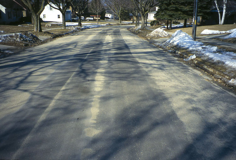 Figure 19. Residue from sand applied to a street surface to provide traction for vehicles.