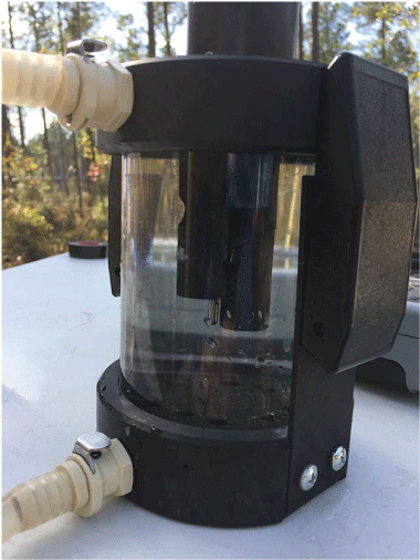 Groundwater pumped from the sand and gravel aquifer into a plastic flow-through chamber
                           is optically clear.
