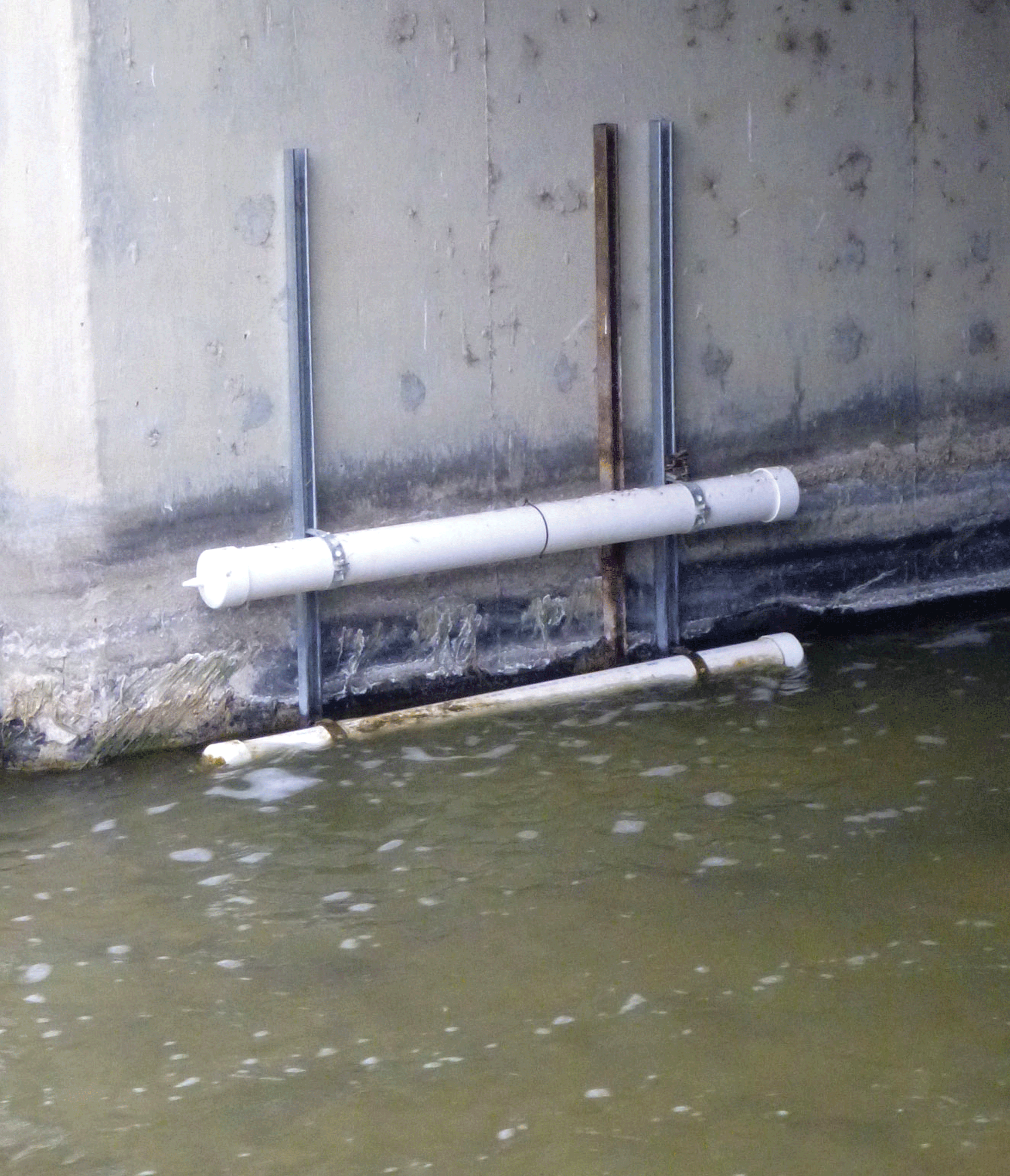 Passive samplers of suspended sediment mounted on a bridge abutment at U.S. Geological
                           Survey streamgage 383926107593001 (Loutsenhizer Arroyo at Highway 50 near Olathe,
                           Colorado).
