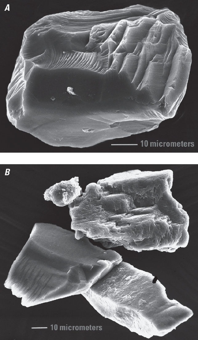 Very close-up views of quartz sand grains with rounded and grooved fracture faces,
                     and a potassium feldspar sand grain that shows jagged cleavage faces.