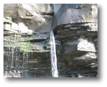 Water pours from stress-relief fractures in a sandstone unit overlying an impermeable
shale layer.