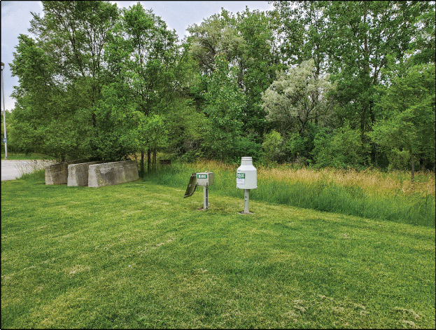 Photograph of the southwest view of the Rain Gage at Lansing, Illinois.