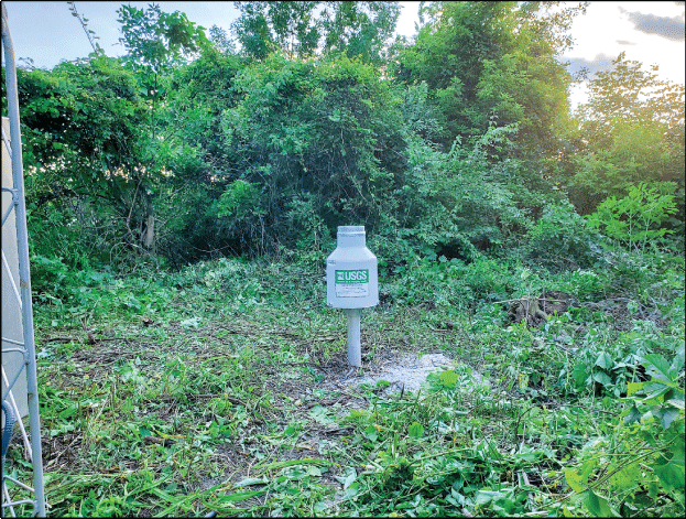 Photograph of the west view of the Rain Gage at Deer Creek near Chicago Heights, Illinois.