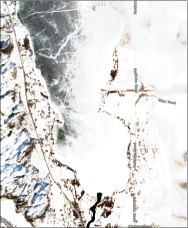 Osoyoos Lake and surrounding land features are shown. Heavy snow and ice are present.