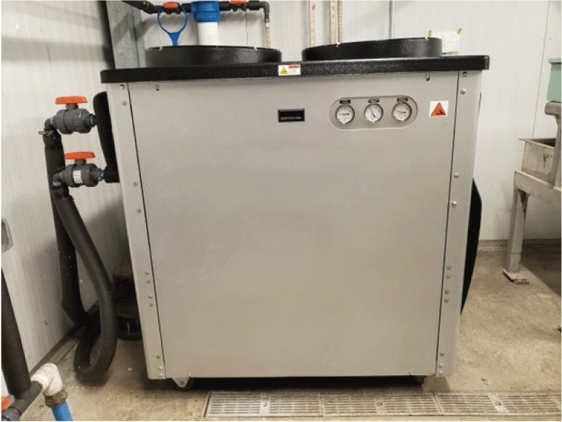 Industrial water chiller is visible.