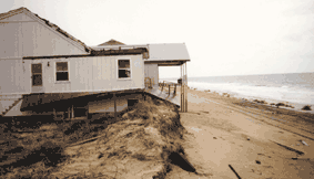 House at Topsail Beach now located seaward of dunes after Hurricane Floyd